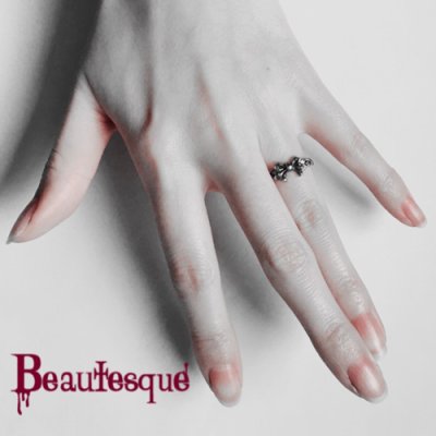 リボンと手のリバーシブルリング|シルバーアクセサリー ビュウテスク