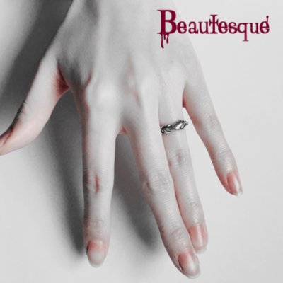 リボンと手のリバーシブルリング|シルバーアクセサリー ビュウテスク